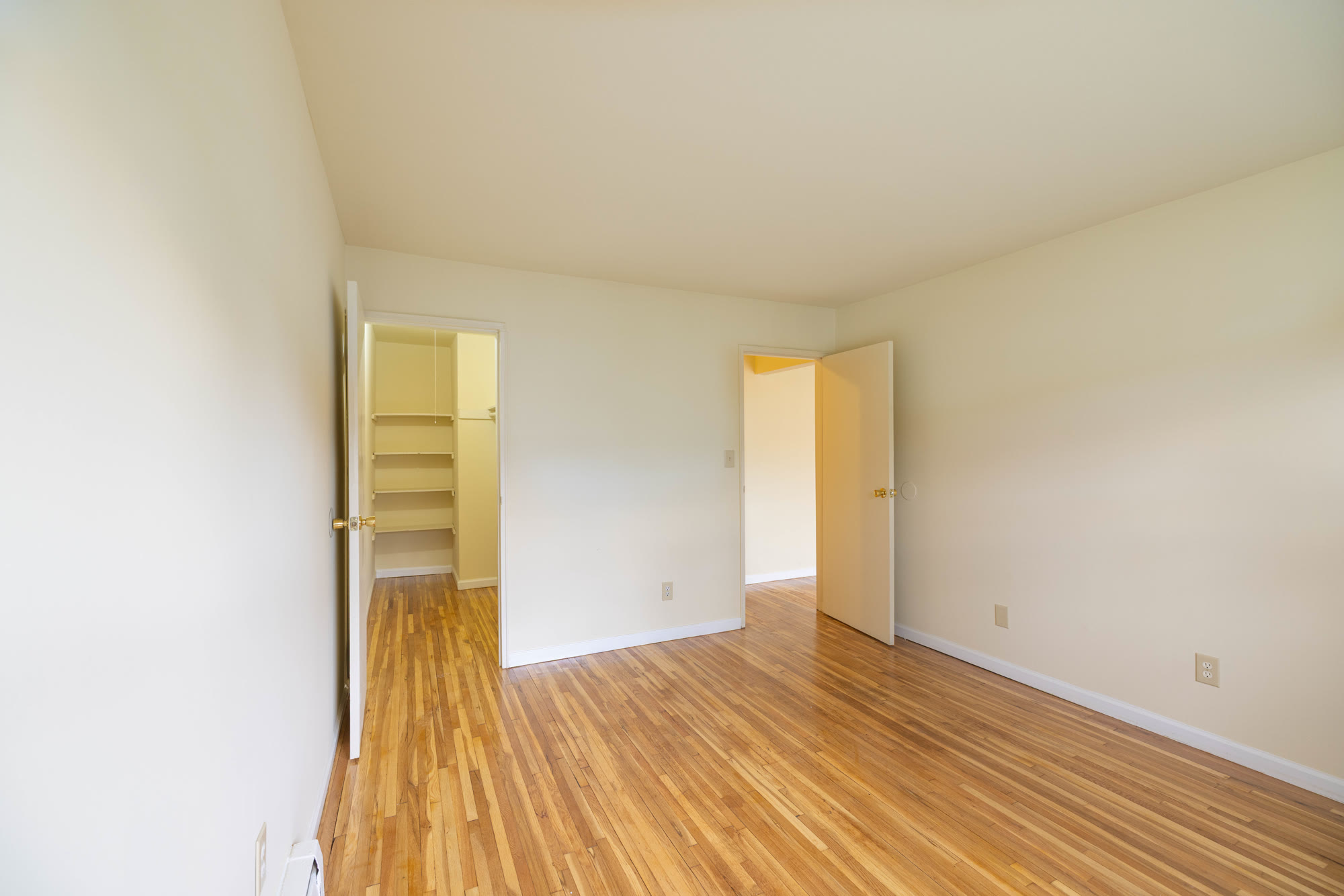 Spacious living room with hardwood floors