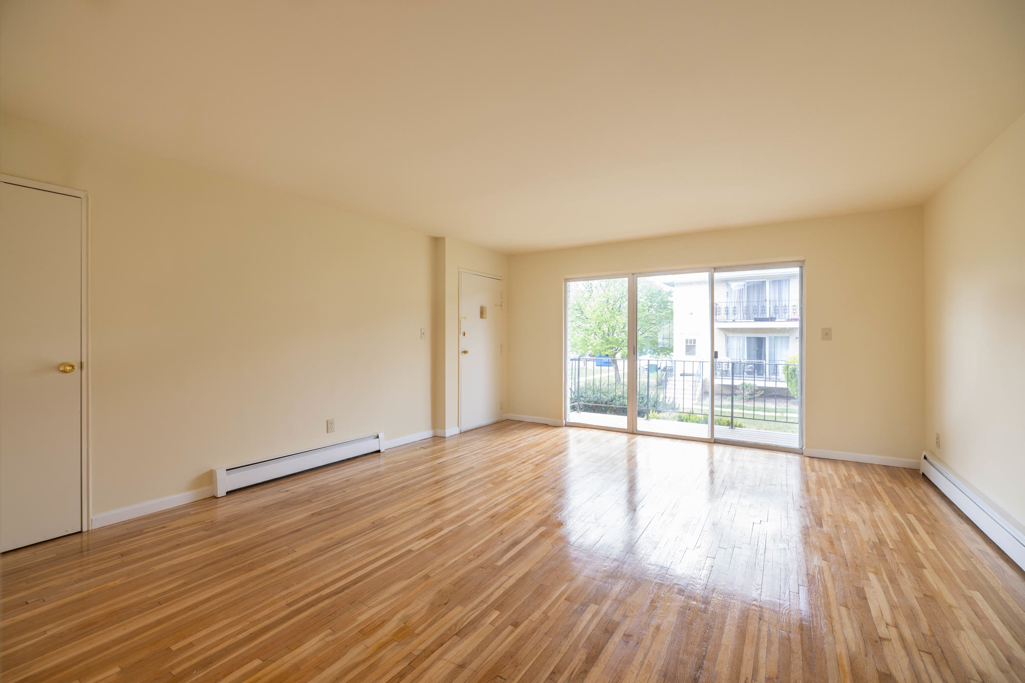 Spacious living room with hardwood floors